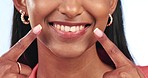 Pointing, mouth and woman closeup with dental wellness, healthcare and oral teeth care in studio. Female person, smile and happy from dentist, cleaning and healthy tooth with white background