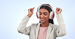 Happy woman, headphones and listening to music, podcast or sound against a studio background. Female person smile, dancing and enjoying audio streaming, playlist or songs with headset on mockup