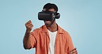 Gamer man, virtual reality and glasses in studio with hand, click and swipe in metaverse by blue background. Person, AR vision and futuristic 3D user experience with grab, cyber ui and digital world