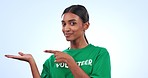 Woman, volunteer and palm pointing in advertising, choice or decision against a studio background. Portrait of female person in charity showing feedback, recommendation or review on mockup space