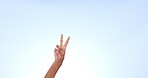 Hand, finger and counting in studio or mockup for advertising, space or promotion on blue background. Peace sign, gesture and show numbers, information or symbol for freedom or positivity with icon