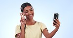 Happy woman, selfie and peace sign for photography, memory or social media against a studio background. Female person smile for photograph, picture or vlog with peaceful emoji for love on mockup