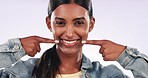 Face, pointing and woman with a smile, mouth and teeth whitening on a white studio background. Portrait, person and model with wellness, dental hygiene and oral health with promotion and aesthetic