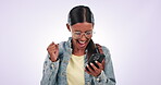 Phone, success or happy woman in studio excited by good news, announcement or promotion notification. Yes, smile or Indian person with winning results or bonus for online gambling on white background