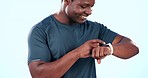 Fitness, black man and smart watch with achievement, progress and connection on a blue studio background. African person, athlete and model with time, clock and digital app with exercise and sports