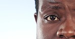 Half, face and closeup of black man with surprise, news or listening to conversation on white background in studio. Person, portrait and shocked reaction to announcement, update or information