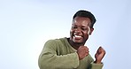 Celebration, excited and black man dance in studio isolated on a blue background. Happy, energy and African person moving to music, radio or audio at party for success, lottery winner and good news