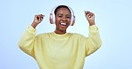 Face, headphones and black woman dancing, streaming music and smile on a blue studio background. Portrait, African person and model with headset, sound and expression with energy, app and celebration