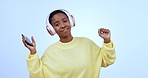 Face, headphones and black woman with a smartphone, dancing and shrug on a blue studio background. Portrait, African person and model with headset, cellphone and expression with energy, app and music