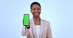 Portrait of black woman with phone, green screen in studio mobile app, website info or social media mockup. Happy businesswoman, smartphone and chromakey for digital networking on blue background.