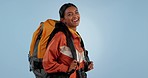 Face, backpacking and woman with a smile, hiking and health on a blue studio background. Portrait, person and model with exercise, adventure and hiker with a journey, wellness and travel with freedom