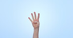 Hands, counting and person in studio on mockup space for education, learning and sign language isolated on a blue background. Finger, palm closeup and math gesture, calculate numbers and countdown