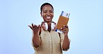 Woman, passport and plane ticket in studio for travel, hand or welcome with smile on face by blue background. African person, documents and compliance with call, invitation or excited for immigration