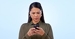 Phone, problem and confused woman in studio frustrated by  fake news, gossip or 404 on blue background. Smartphone, fail and Asian lady model annoyed by social media hacker, glitch or password error