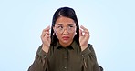 Blurred, vision and portrait of woman with glasses and happy with eyesight on white background in studio. Squinting, face and woman with a smile for eyewear, spectacles and healthcare prescription 