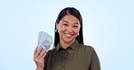 Money fan, smile and face of woman in studio happy with loan, payment or financial freedom on blue background. Cash, savings and portrait of Asian female winner with investment, growth or poker deal