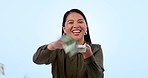Money, cashflow and face of woman in studio happy with loan, payment or financial freedom on blue background. Cash, savings and portrait of Asian female winner with investment, growth or poker deal