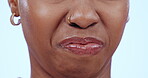 Mouth, gross and disgust with a woman closeup in studio on a blue background to express her dislike. Face, nose and bad aroma with a person smelling the awful scent of gas or bacteria in the air