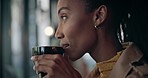 Woman, drinking and beverage while thinking in cafe with cup for calm, relax and joy. African person, hand and hold of delicious coffee, cappuccino or latte in restaurant while looking out window