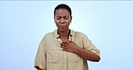 Black woman, chest pain and heart health, sick in studio and wellness, medical emergency on blue background. Illness, lungs and indigestion with mockup space, cardiovascular healthcare or anxiety