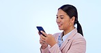 Business, smile and woman with a cellphone, typing and social media on a blue studio background. Person, consultant or employee with a smartphone, digital app and network with contact or website info