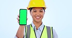 Green screen phone, builder and a woman with mockup for construction promo or app information. Smile, face portrait and a female logistics employee with space on a mobile and studio background