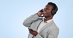 Happy black man, headphones and listening to music in audio streaming against a blue studio background. Energetic African businessman smile, dancing or enjoying sound podcast on mobile smartphone app