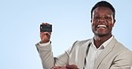 Happy black man, credit card and palm in finance, advertising or banking against a blue studio background. Portrait of African businessman smile showing debit for payment, transaction or bank account