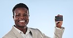Happy businessman, credit card and finance for banking or advertising against a blue studio background. Portrait of African or black man smile showing debit for payment, transaction or bank account
