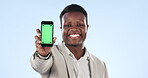 Happy black man, phone and green screen for advertising or marketing against a studio background. Portrait of African businessman smile and showing mobile smartphone app, display or mockup space