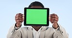 Black man, tablet and green screen for advertising or marketing against a studio background. African businessman showing technology display, app or tracking markers on mockup space for advertisement