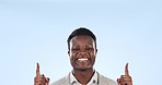 Happy black man, pointing up and advertising in marketing or studio against a blue background. Portrait of African businessman smile and showing deal, sale discount or notification on mockup space