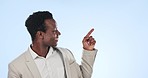 Happy black man, pointing and list in advertising or marketing in studio against a blue background. Portrait of African businessman smile and showing steps, options or information on mockup space