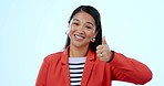 Thumbs up, smile and face of woman in a studio with approval, agreement or good hand gesture. Happy, portrait and young Asian female model with satisfaction expression isolated by white background.