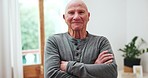 Home, face and senior man with arms crossed, smile and confident guy in a living room. Face, pensioner and elderly person with retirement, happiness and old age with happiness, weekend break and care