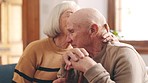 Couple, support and senior man stress with kiss and care in a home with love and empathy. Anxiety, retirement and marriage of elderly people together on a house couch with hug and rest with kindness 