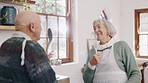 Kitchen, sing and senior couple dance together with cooking utensils for lunch, supper and dinner. Marriage, retirement and man and woman at home with food for meal prep for bonding, fun and playful