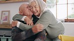 Senior couple, hug and kiss at home with marriage support and love together with smile and loyalty. Retirement, relax and elderly people in house with happy, kindness and care of pensioner with trust