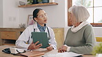 Senior woman, doctor and tablet for healthcare, communication and advice or conversation. Elderly person, medical professional and technology or results, online and speaking in retirement at home