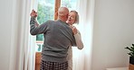 Happy, dancing or old couple hug in living room for love bond, care or freedom together at home. Smile, elderly man or senior woman in celebration for anniversary, holiday or romance in retirement 