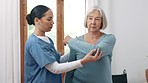 Nurse, patient and rehabilitation for injury in facility with examination for recovery. Senior woman, shoulder and pain in retirement by consultation with medical professional for care, help or trust