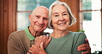 Face, smile and senior couple in home, hug and bonding together in living room. Happy elderly man, woman and portrait of love in lounge, healthy relationship and connection, care and support in house