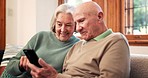 Relax, online and senior couple on sofa with phone, app or streaming a video on social media with internet. Reading, cellphone and people in retirement scroll news, website or post in living room