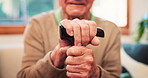 Walking stick, hands and person with disability, parkinson support for healthcare in retirement home. Closeup, senior patient and help of wood cane for balance of arthritis, rehabilitation and stroke