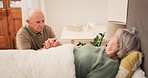 Bed, care and senior couple holding hands for support, bonding and compassion at home together. Retirement home, marriage and elderly man and sick woman in bedroom for illness, healing and recovery