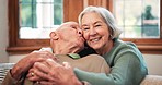 Face of senior couple, kiss and hug in home for love, care or together for happy retirement in marriage. Portrait, old woman and embrace man for loyalty, affection or relax for support in living room