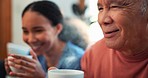 Face, coffee or relax with a nurse and patient on a sofa in the living room of a home for assisted living. Tea, charity or visit with a woman volunteer and senior man in an apartment for retirement