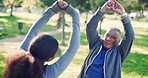 Stretching, wellness and senior man in park with caregiver and physical therapy outdoor for health. Retirement, exercise help and female physio with support, fitness and workout on grass together