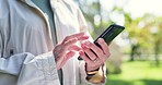 Senior woman in park with phone, typing and scroll on social media, message or chat online. Internet, smartphone and communication, old person in garden checking website and reading on mobile app.