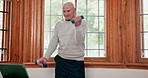 Senior man, dumbbell exercise and tablet in retirement home for online tutorial, fitness and workout for wellness. Elderly person, training and technology for learning bodybuilding on digital video